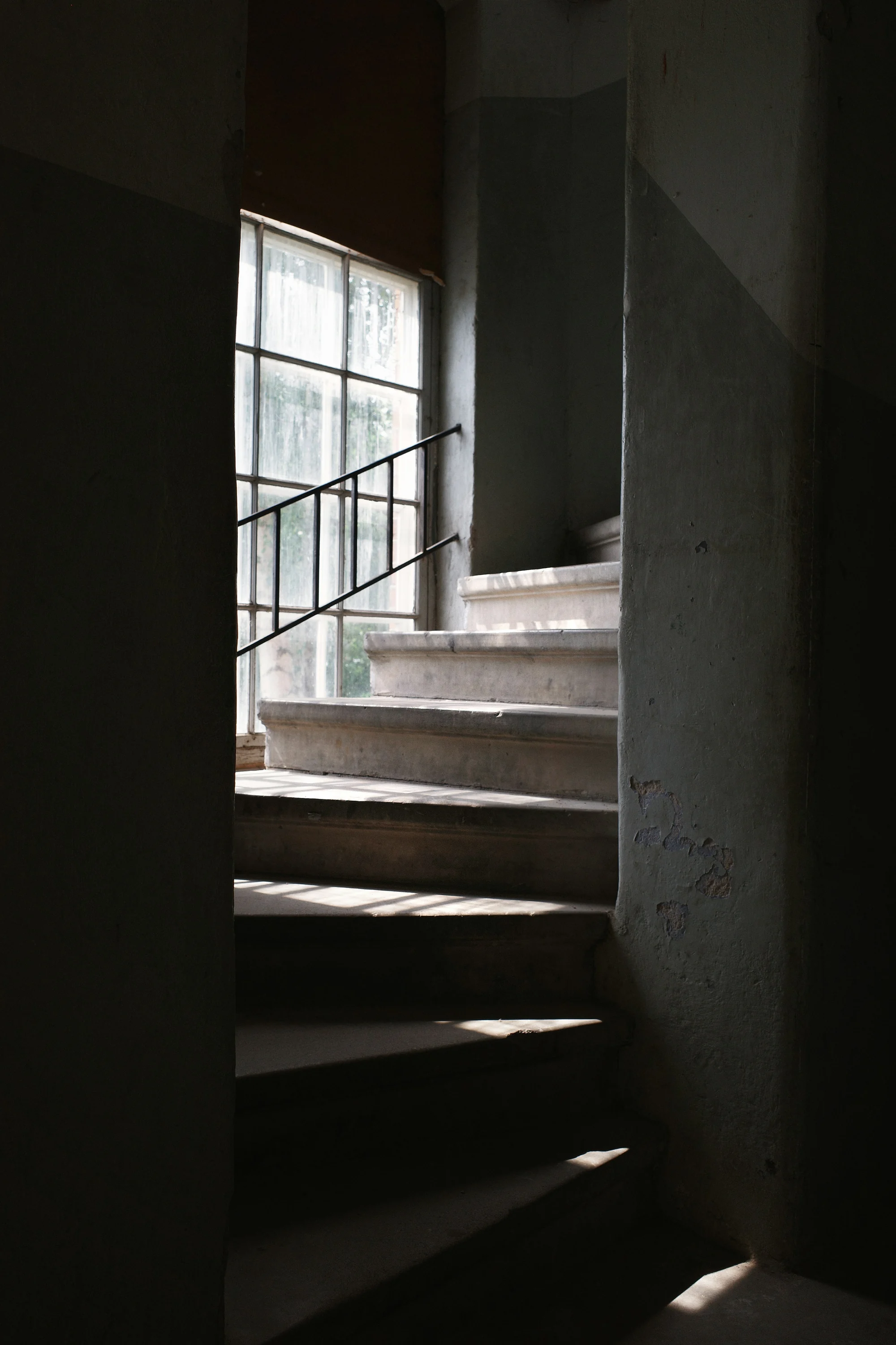 Sunlight falling down a concrete staircase